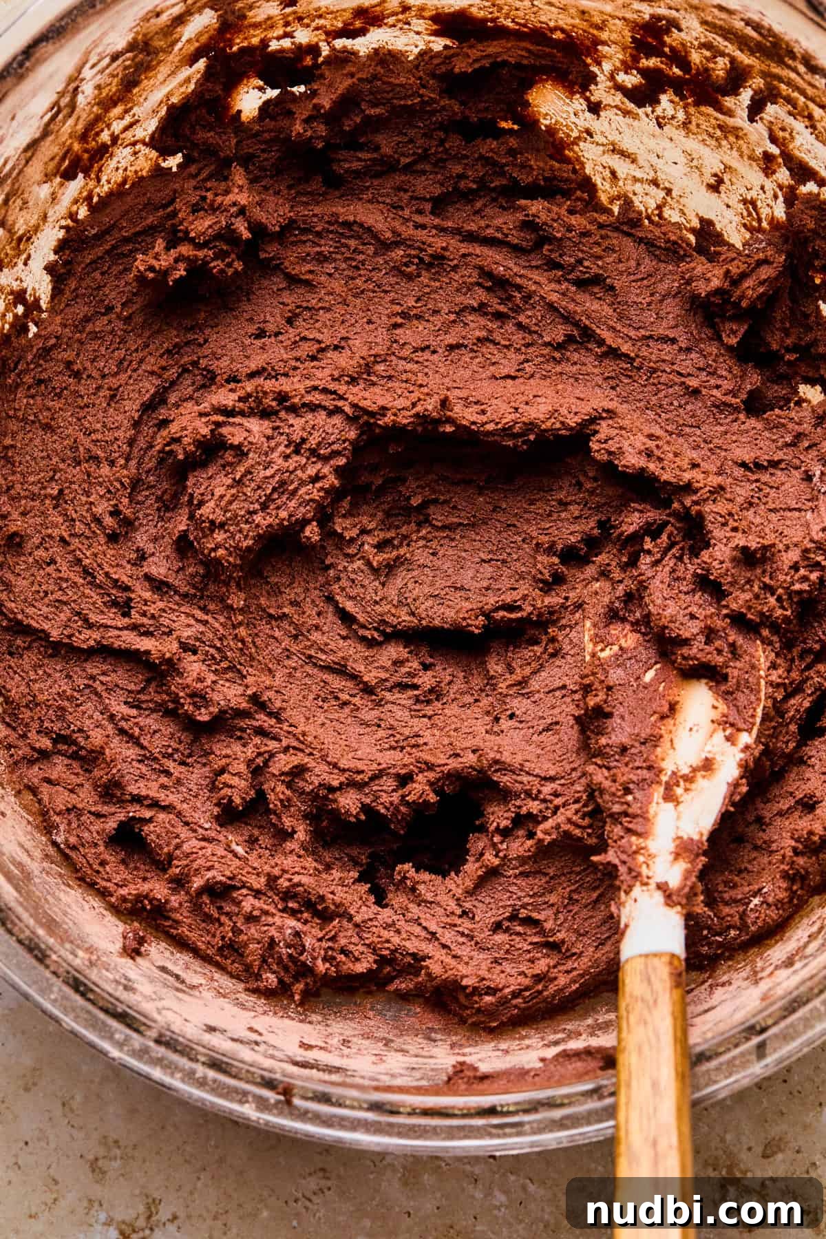 Cosmic Brownie Cookie Recipe: Fudgy, Colorful Chocolate Cookies 9 Cosmic brownie cookie dough in bowl with spatula.