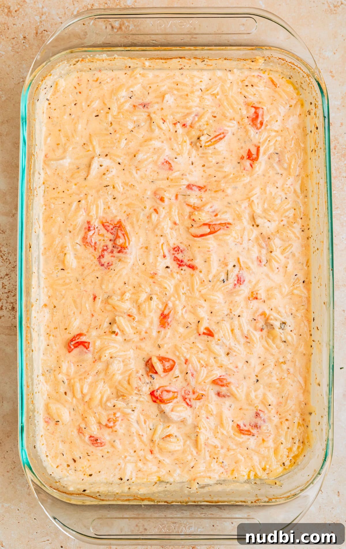 Creamy Baked Chicken and Orzo Casserole for Weeknight Dinners 9 Stirred baked chicken and orzo.