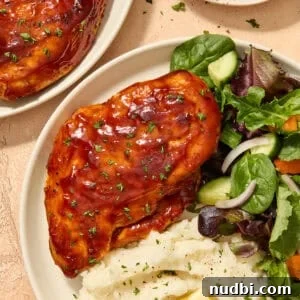 25 Must-Try Recipes Trending in 2025 19 Air fryer barbecue chicken breast on plate with sides.