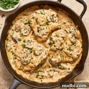 25 Must-Try Recipes Trending in 2025 6 Skillet with cream of mushroom pork chops topped with chopped parsley.
