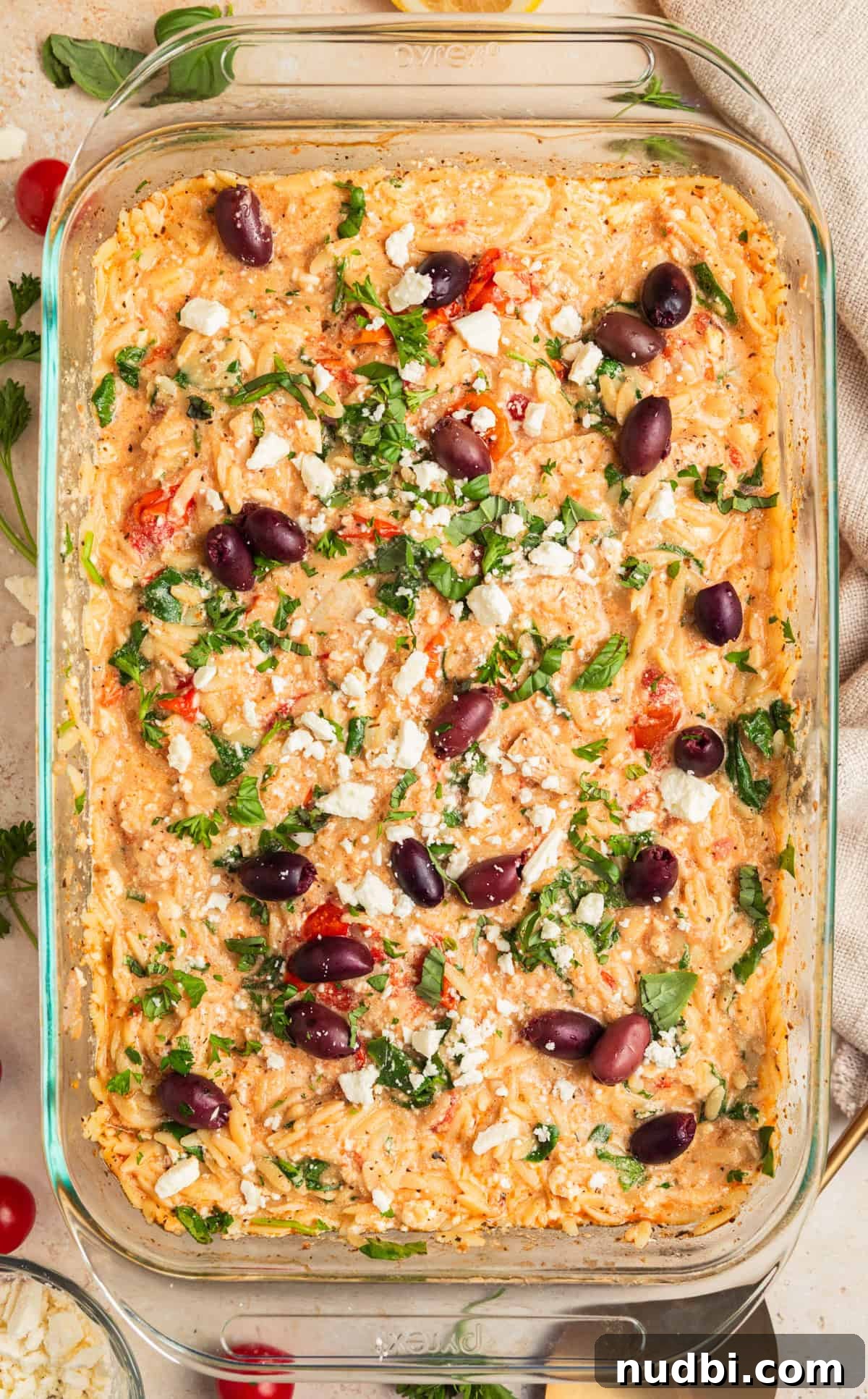 Greek Chicken with Lemon Orzo Pilaf: Flavorful Mediterranean Recipe 10 Baked Greek chicken and orzo with feta, olives and parsley over top.
