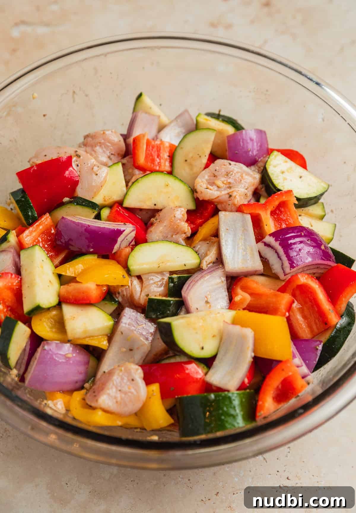 Greek-Style Sheet Pan Chicken Dinner with Lemon & Olives 6 Zucchini, peppers and onion added to chicken and marinade mixture.