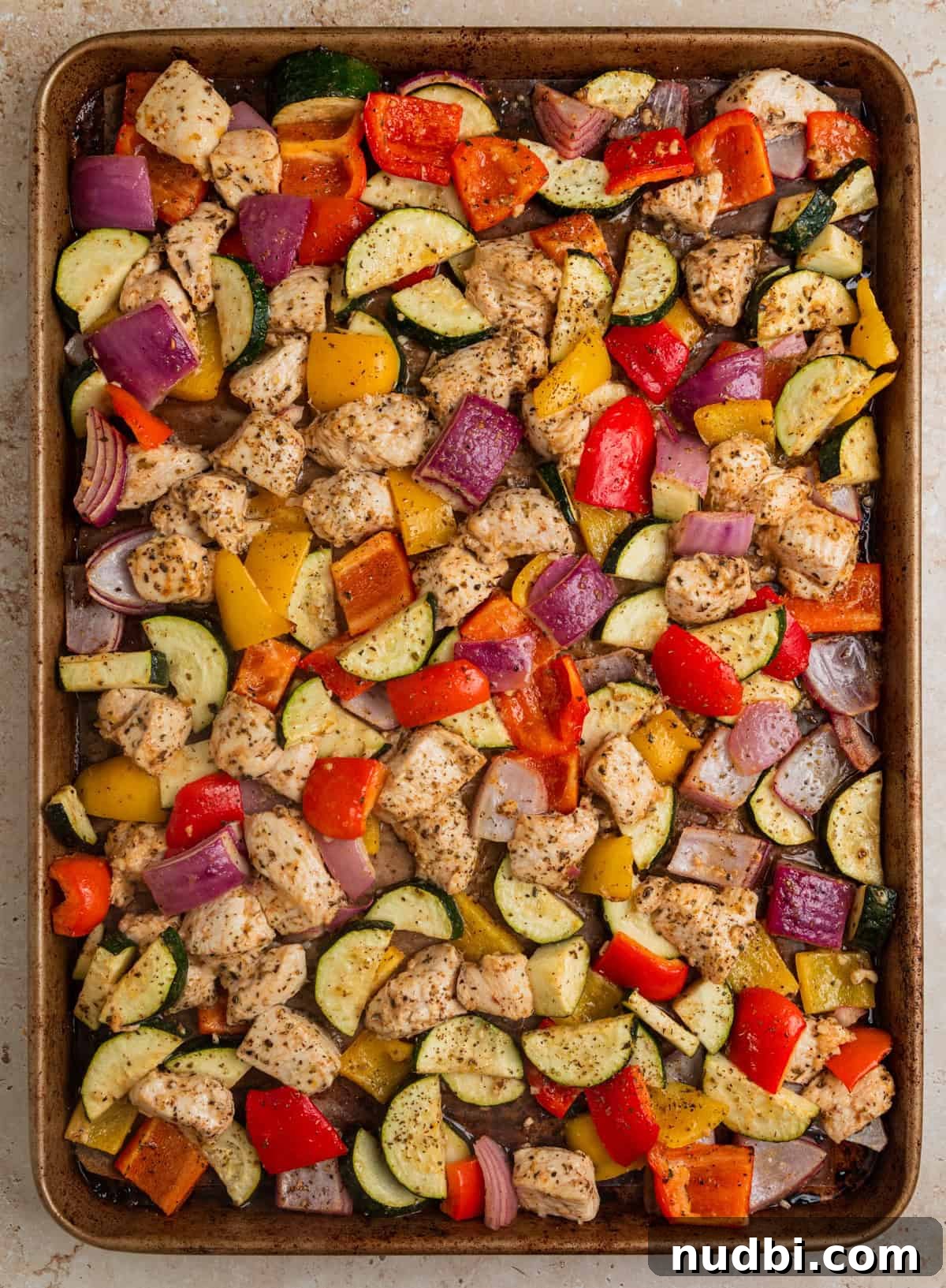Greek-Style Sheet Pan Chicken Dinner with Lemon & Olives 8 Baked Greek chicken and vegetables on sheet pan.