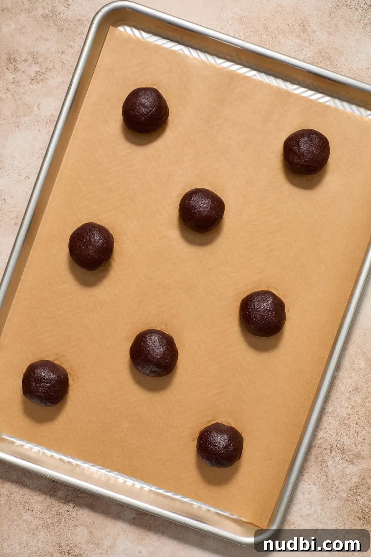 Molten Chocolate Lava Cookies Recipe: Gooey Center Cookies Tutorial 13 Chocolate lava cookie dough balls on parchment lined pan.