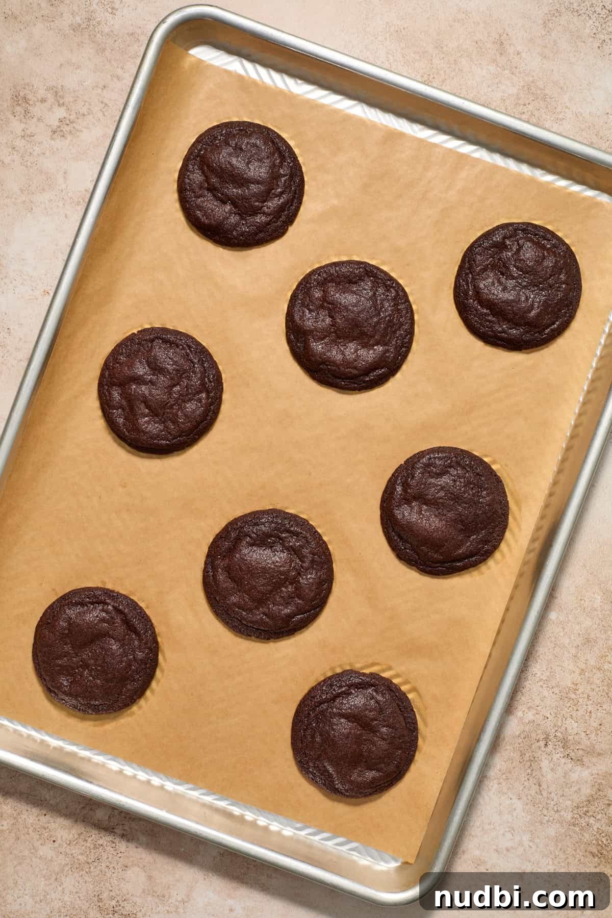 Molten Chocolate Lava Cookies Recipe: Gooey Center Cookies Tutorial 14 Baked chocolate lava cookies on cookie sheet.