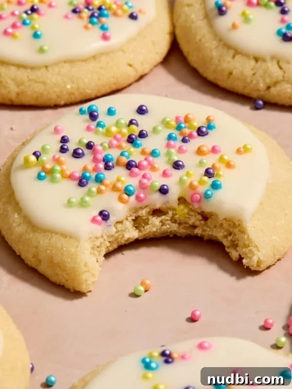 Molten Chocolate Lava Cookies Recipe: Gooey Center Cookies Tutorial 16 Eggless sugar cookies on surface with bite taken out of cookie.
