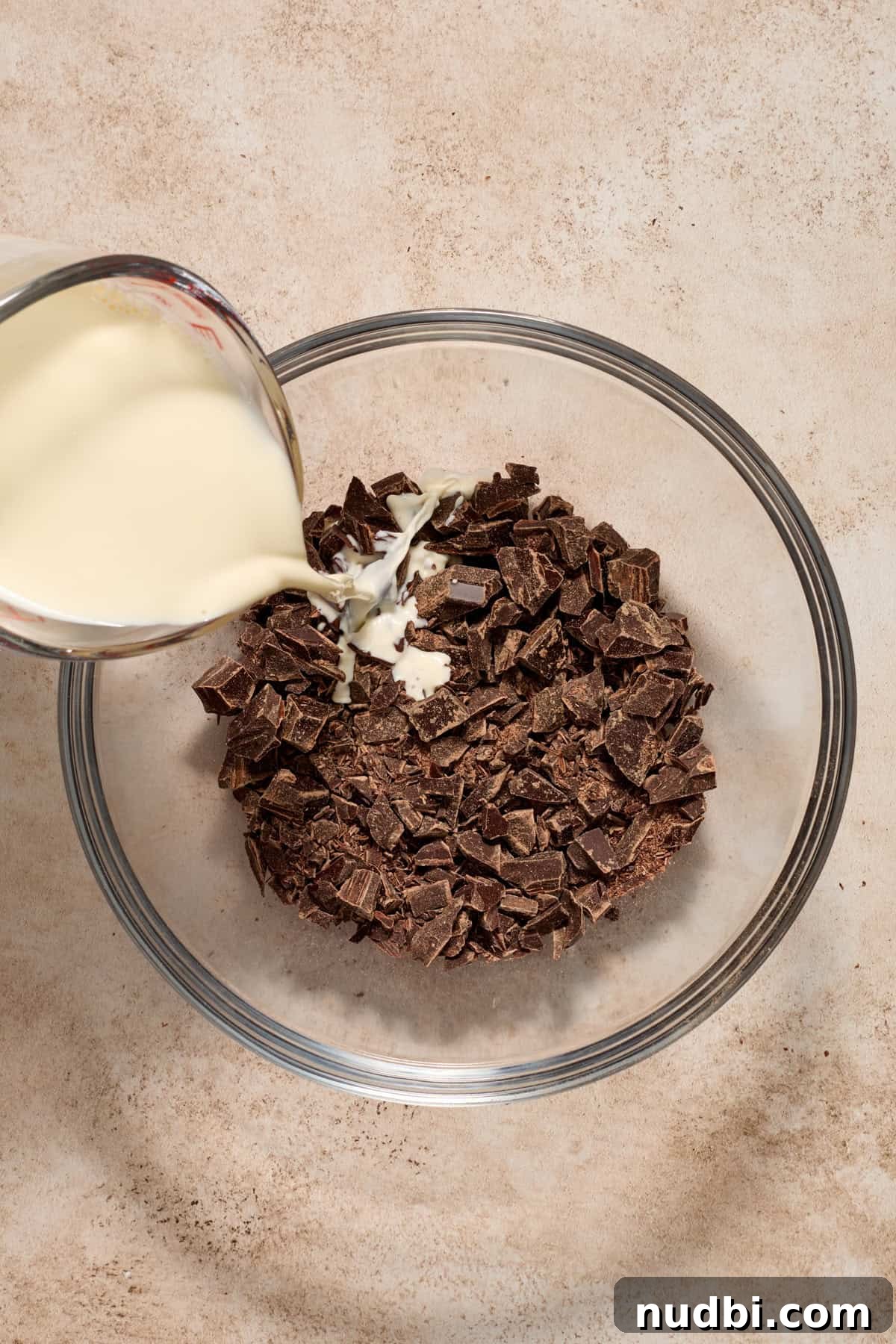 Molten Chocolate Lava Cookies Recipe: Gooey Center Cookies Tutorial 5 Hot heavy cream being poured over chopped chocolate.