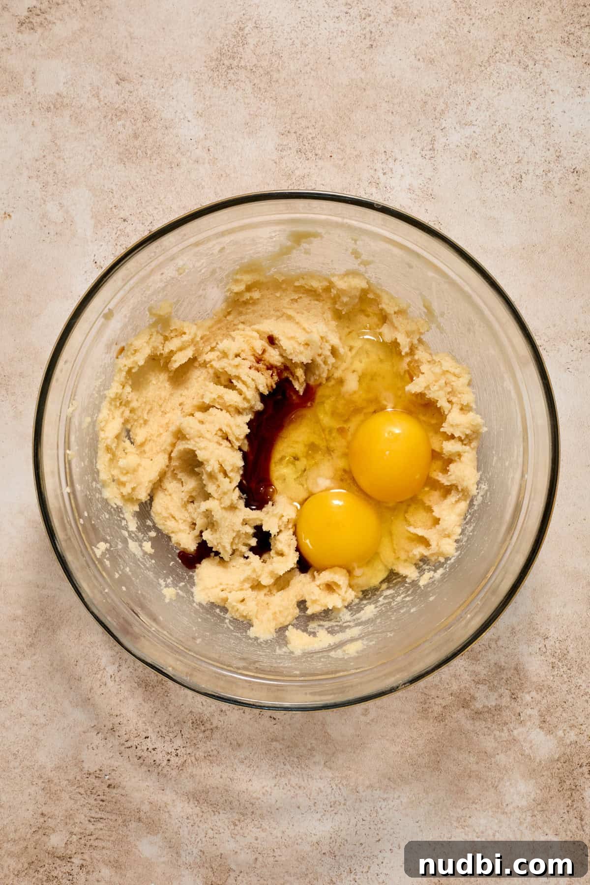 Molten Chocolate Lava Cookies Recipe: Gooey Center Cookies Tutorial 9 Eggs and vanilla added to glass bowl with creamed butter and sugars.