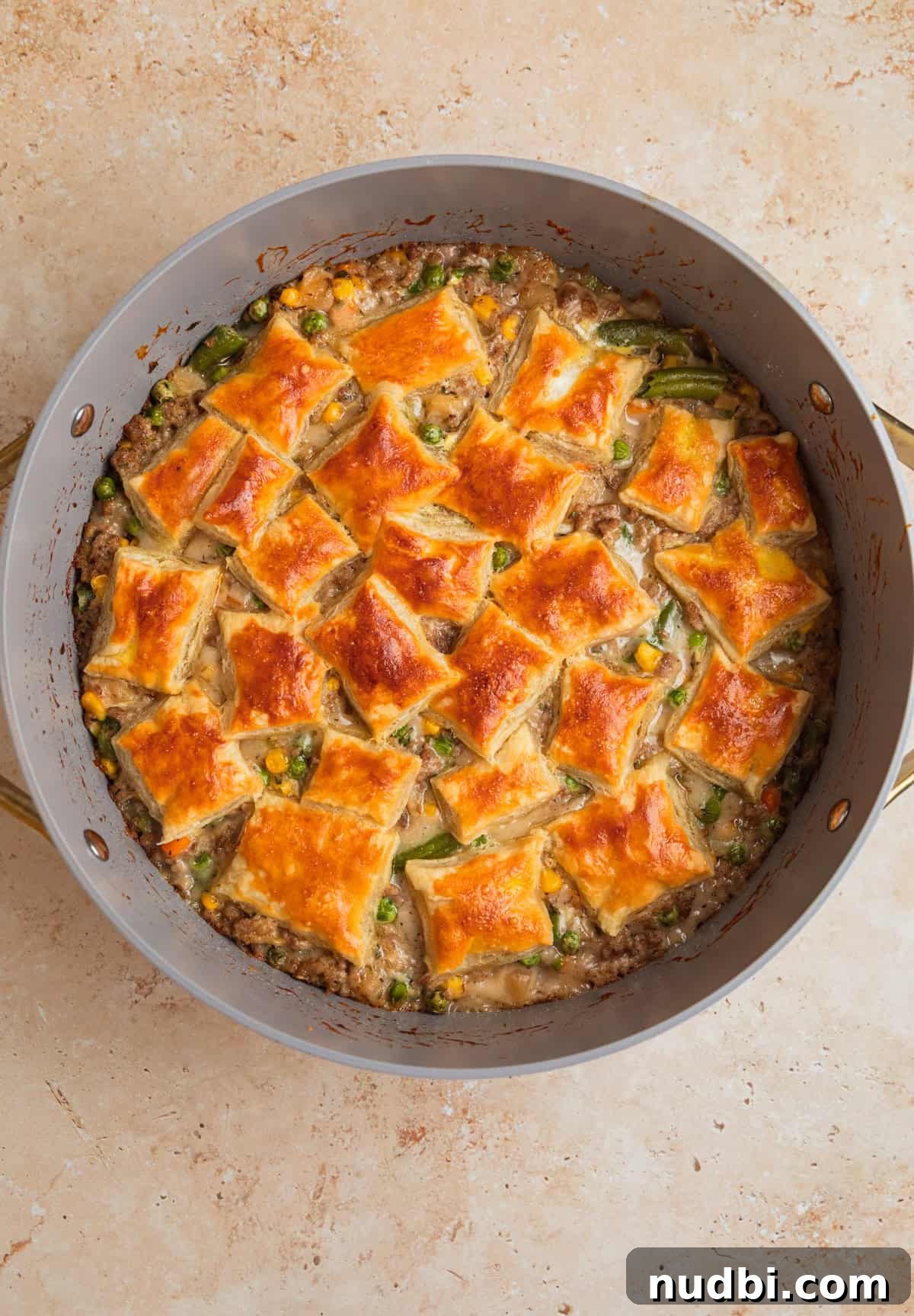 Savory Ground Turkey Pot Pie Recipe for Comforting Dinners 8 Skillet with puff pastry topped turkey pot pie fresh from the oven.