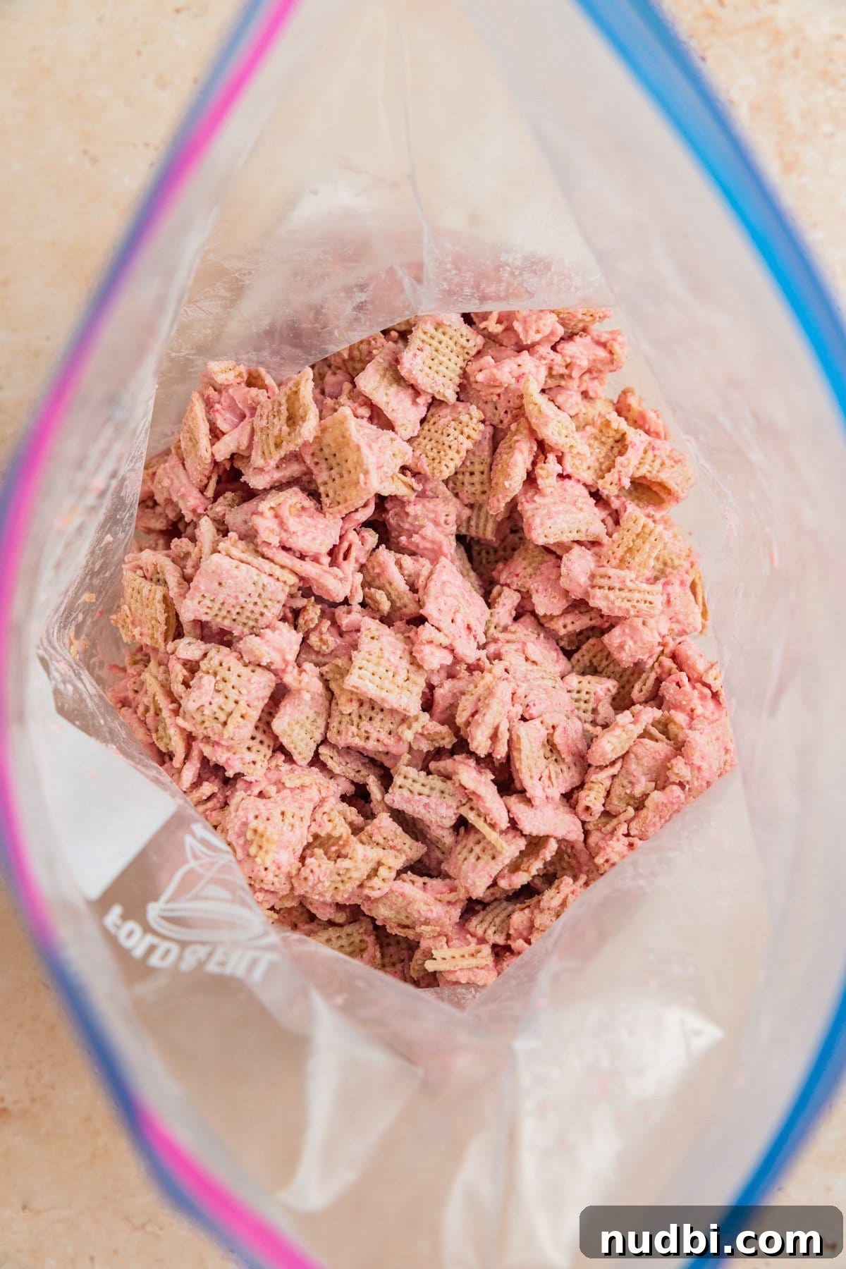 Strawberry Chex Mix Recipe: Sweet, Crunchy Snack for Parties 11 Ziplock bag with strawberry white chocolate coated Chex.
