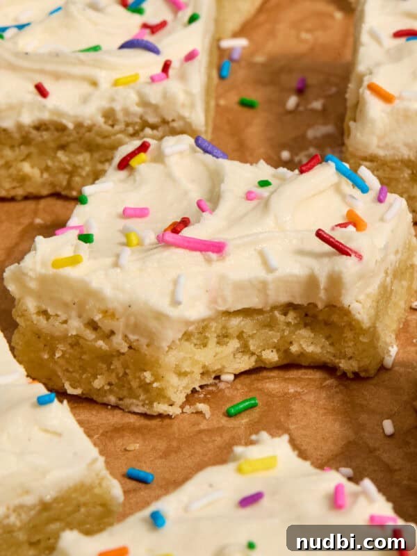 Strawberry Chex Mix Recipe: Sweet, Crunchy Snack for Parties 17 Vanilla bean frosted sugar cookie bars with rainbow sprinkles on parchment.