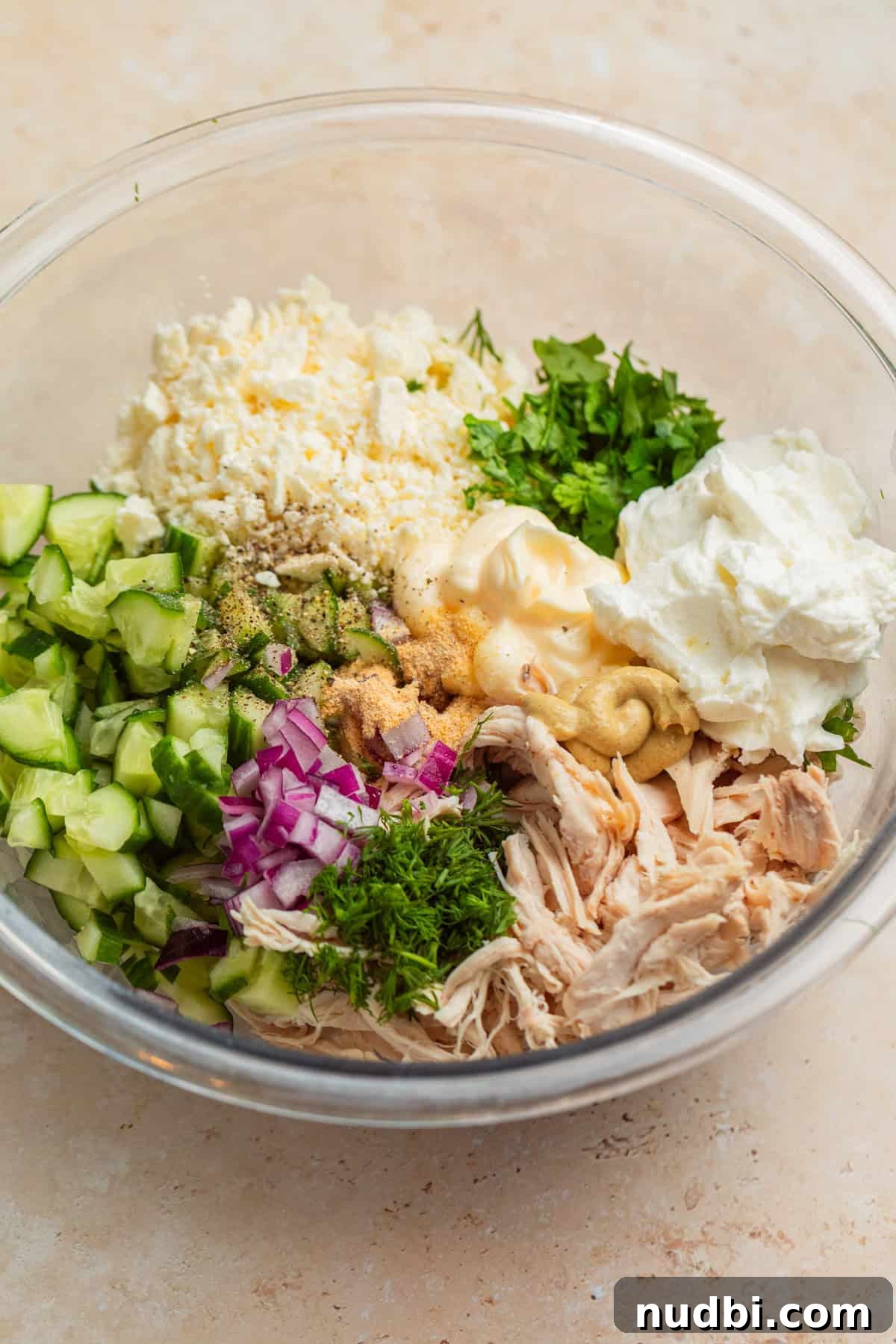 Cucumber, Feta & Chicken Salad with Lemon-Dill Dressing 5 Shredded chicken, diced cucumbers, feta crumbles, Greek yogurt and other ingredients in mixing bowl.