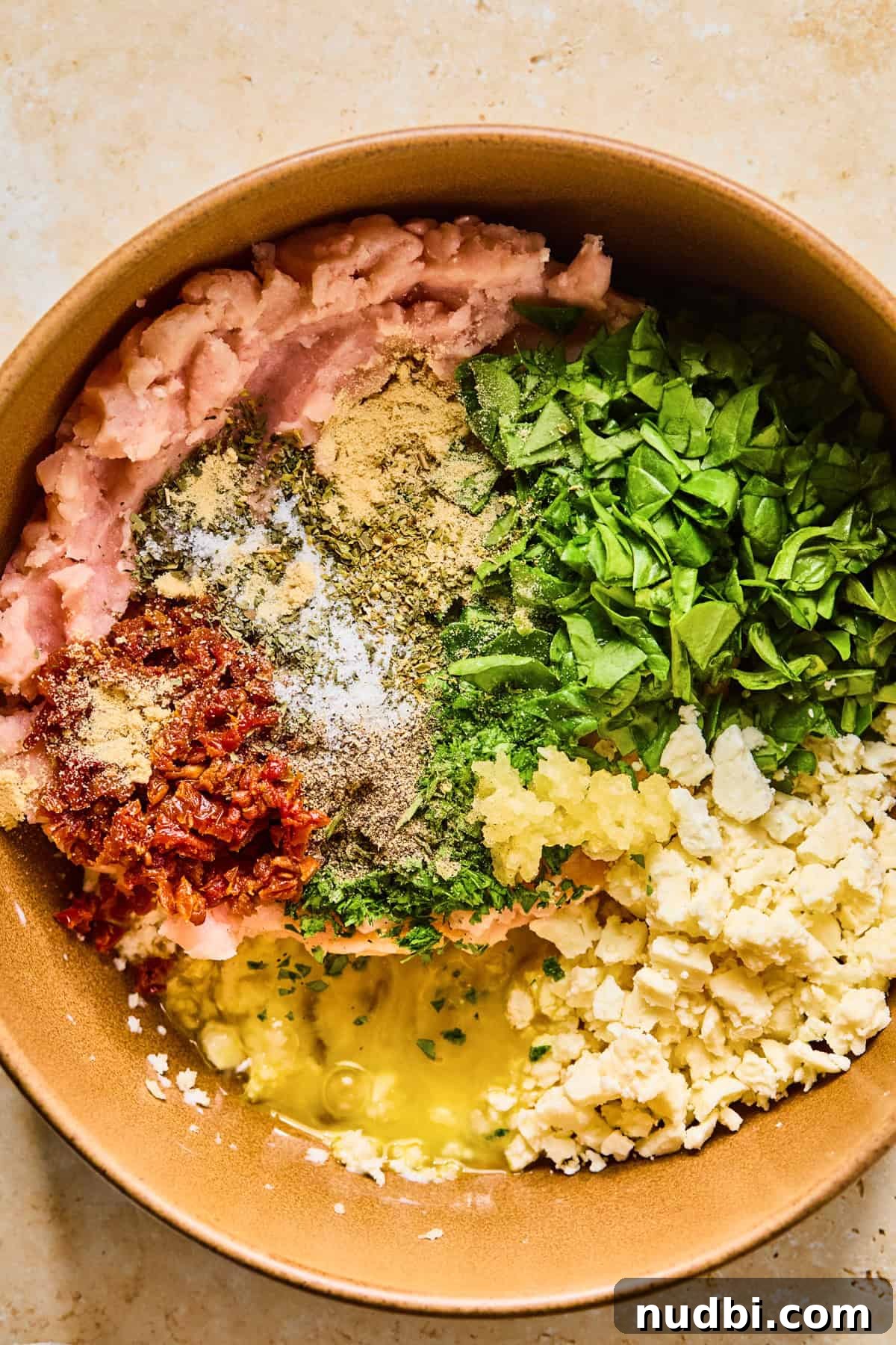 Spinach and Feta Turkey Meatballs with Garlic Herb Sauce 6 Turkey, egg, spinach, feta and other ingredients in mixing bowl.