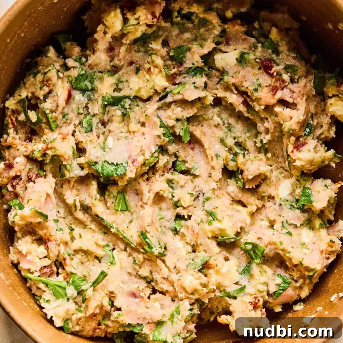 Spinach and Feta Turkey Meatballs with Garlic Herb Sauce 7 Turkey feta meatball mixture in bowl.