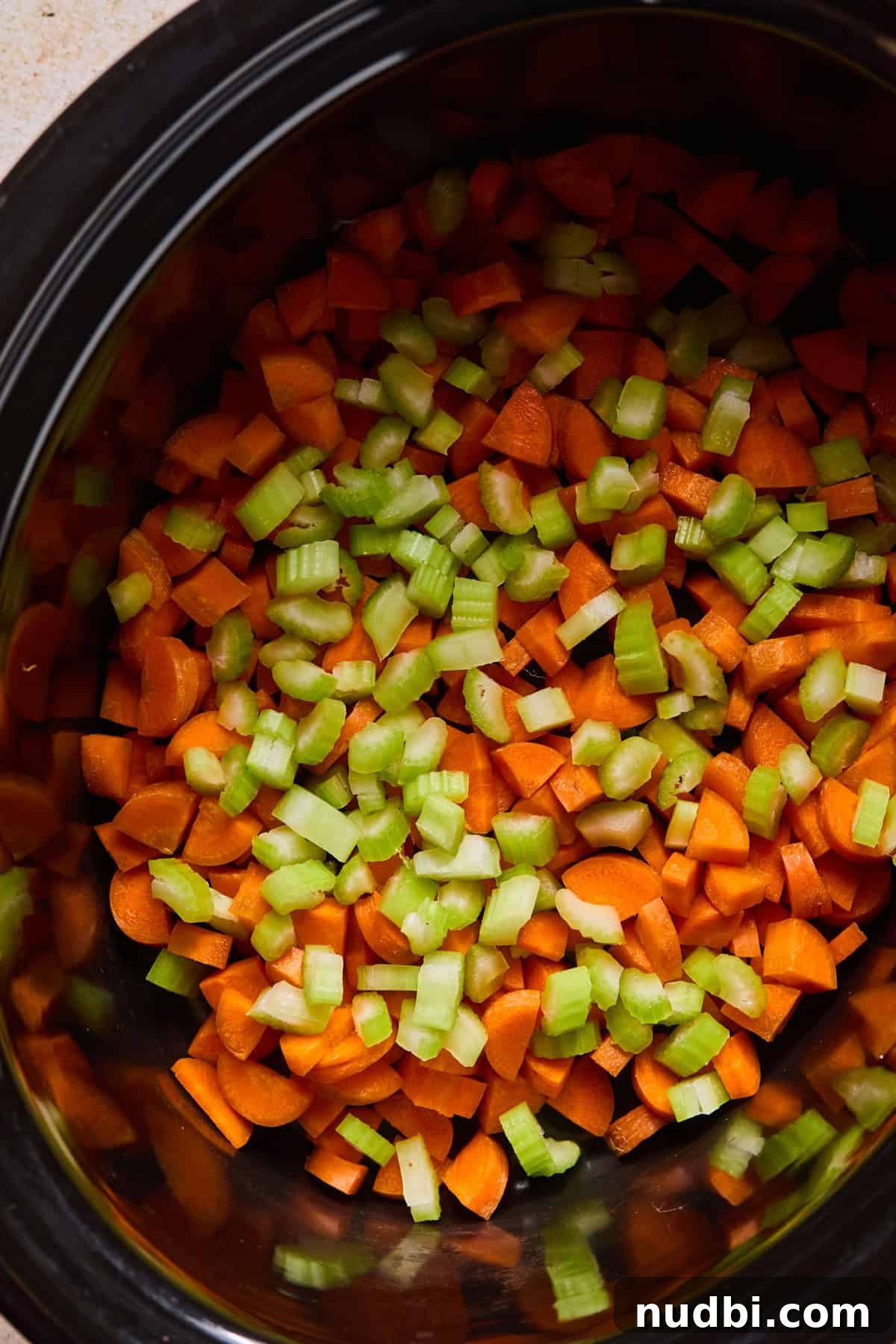 Slow-Cooker Sausage and Tortellini Soup Recipe 7 Carrots and celery added to crockpot.