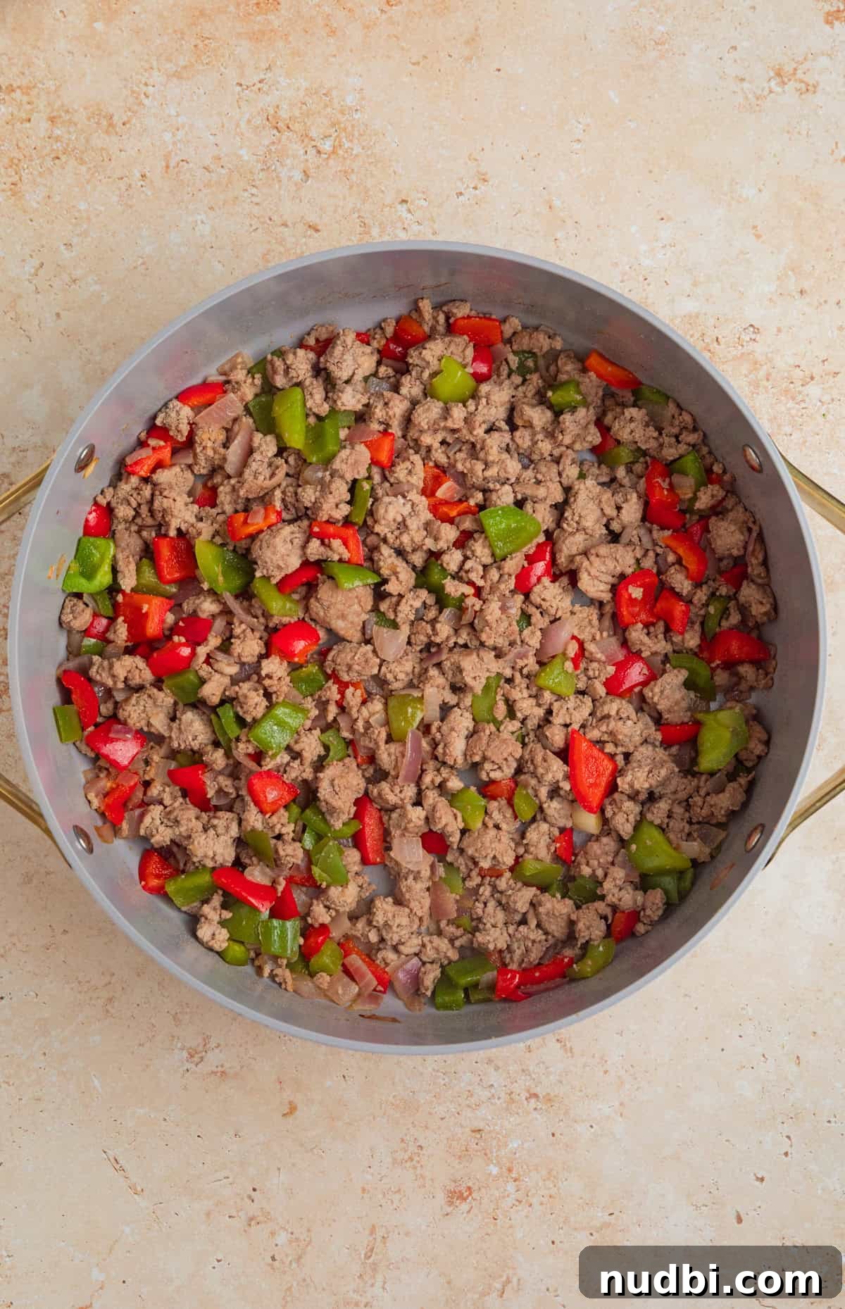Cheesy Turkey Taco Skillet Dinner Recipe 6 Browned turkey in pan with onions and peppers.