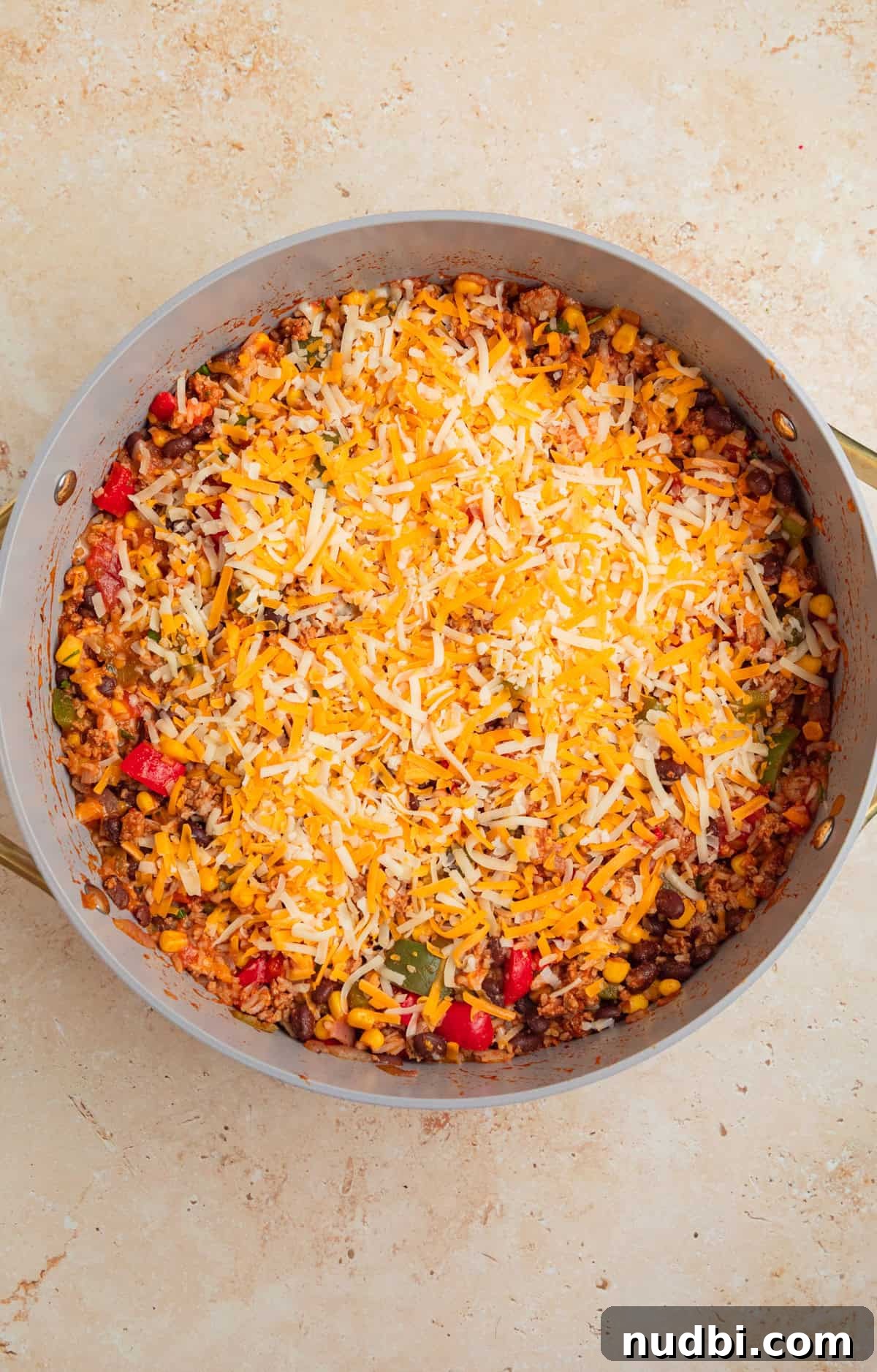 Cheesy Turkey Taco Skillet Dinner Recipe 9 Shredded cheese sprinkled over top of taco and rice skillet.