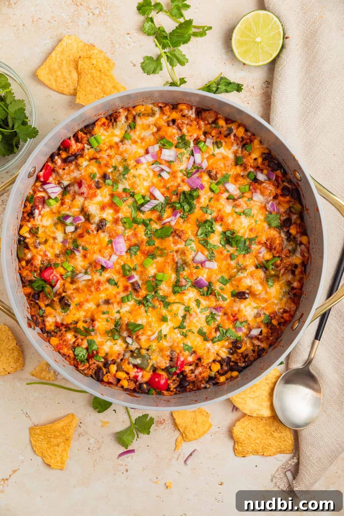 Cheesy Turkey Taco Skillet Dinner Recipe 10 Cheesy taco skillet dinner with garnishes on top.