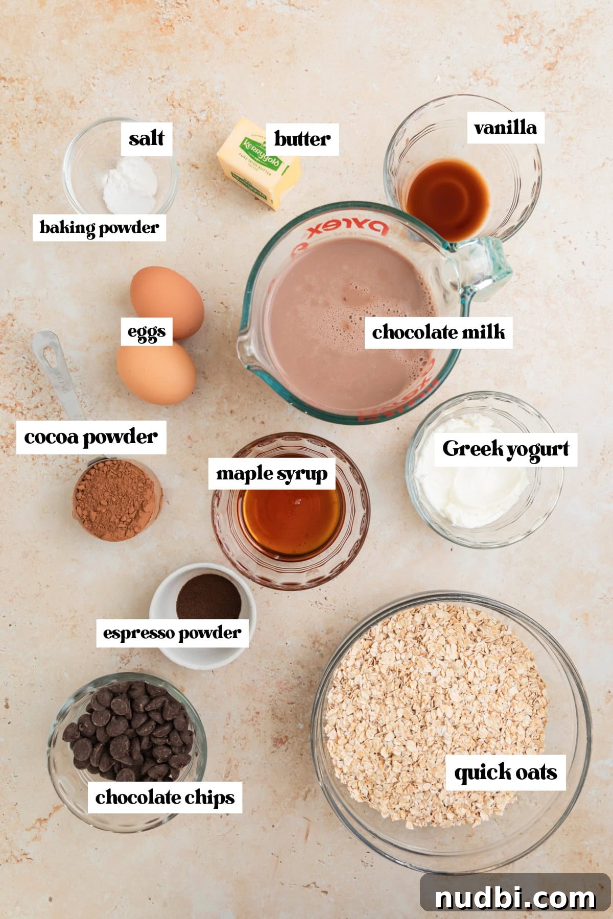 Decadent Chocolate Baked Oats Recipe for Breakfast and Snacks 4 Chocolate milk, eggs, vanilla, cocoa powder and other labeled ingredients.