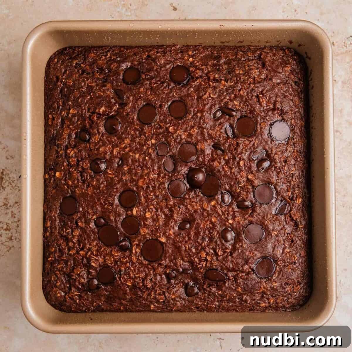 Decadent Chocolate Baked Oats Recipe for Breakfast and Snacks 8 Baked chocolate oats in pan.