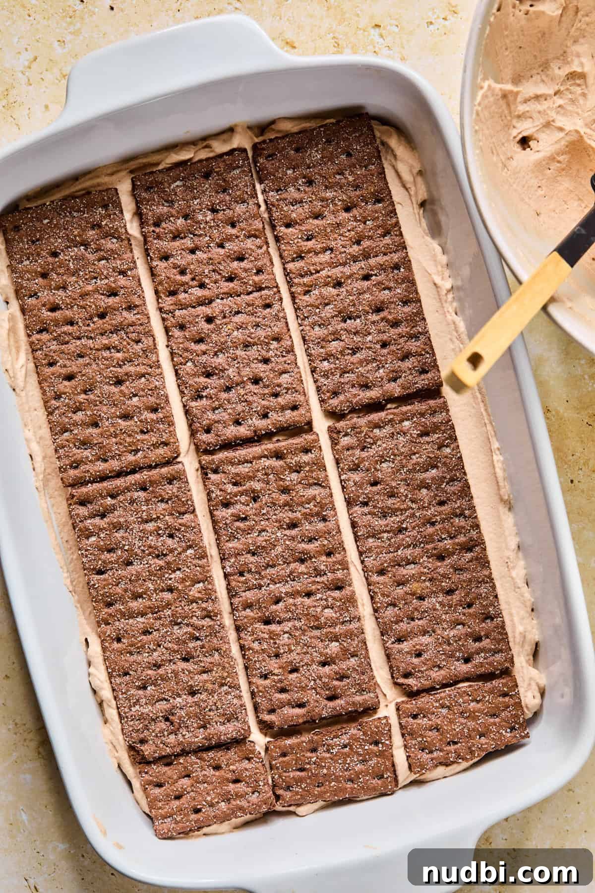Decadent No-Bake Chocolate Icebox Cake Recipe 15 Chocolate graham crackers layered over chocolate cream.