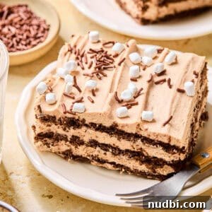 Decadent No-Bake Chocolate Icebox Cake Recipe 18 Slice of chocolate layered icebox cake topped with sprinkles and marshmallows.