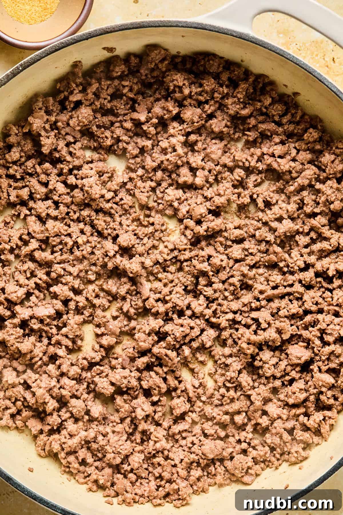 Philly Cheesesteak Rice Bowl Recipe — Savory Steak & Peppers 6 Browned ground beef in skillet.