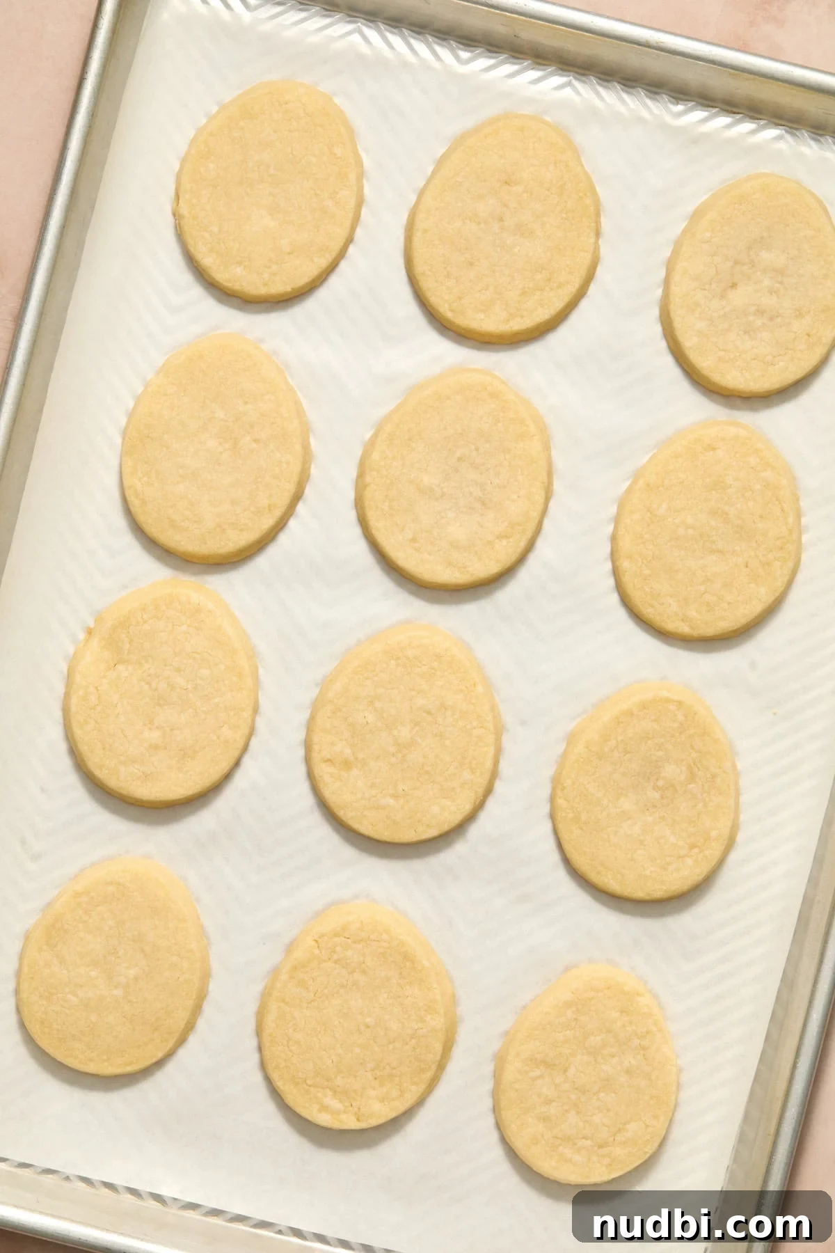 Speckled Easter Egg Shortbread Cookies Recipe 11 Baked Easter egg shortbread cookies on pan.