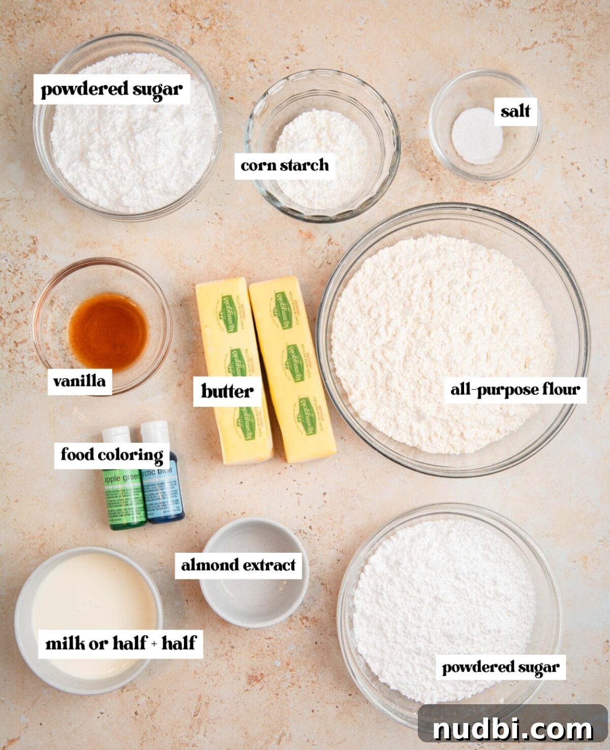 Speckled Easter Egg Shortbread Cookies Recipe 4 Powdered sugar, butter, flour and other ingredients labeled on surface.