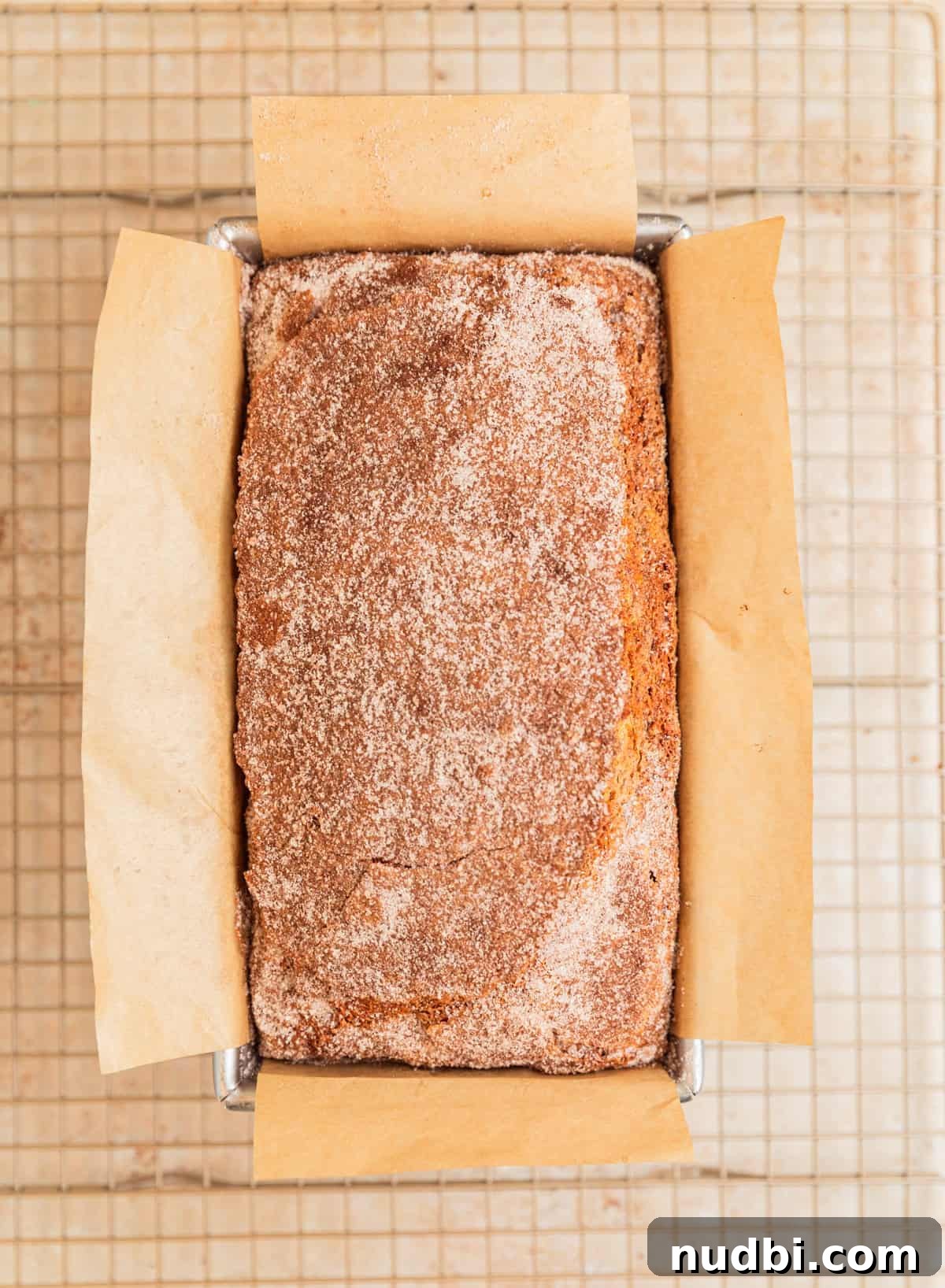 Moist Cinnamon Banana Bread Recipe with Warm Spice Flavor 12 Baked cinnamon banana bread on cooling rack.