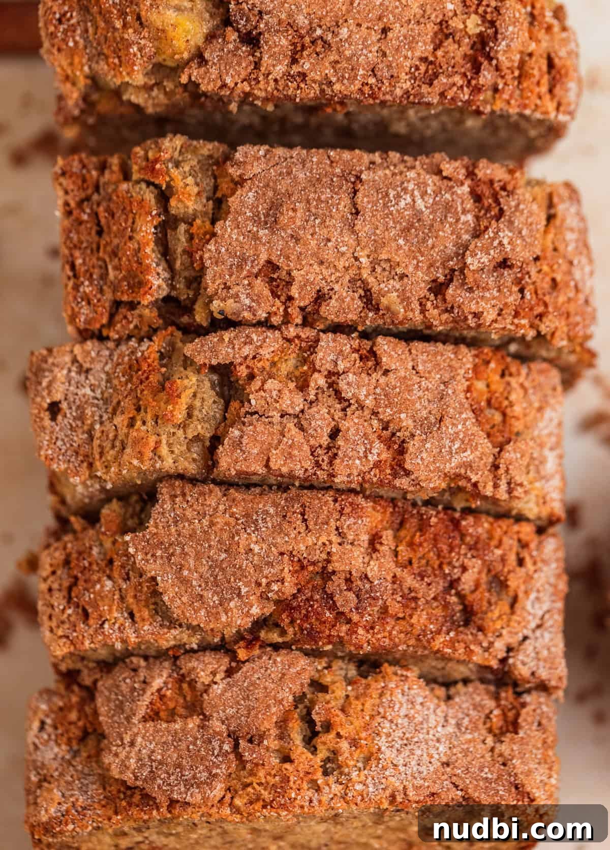 Moist Cinnamon Banana Bread Recipe with Warm Spice Flavor 13 Overhead view of cinnamon sugar topped banana bread slices.