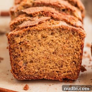 Moist Cinnamon Banana Bread Recipe with Warm Spice Flavor 14 Cinnamon crunch topped banana bread propped up in a row.