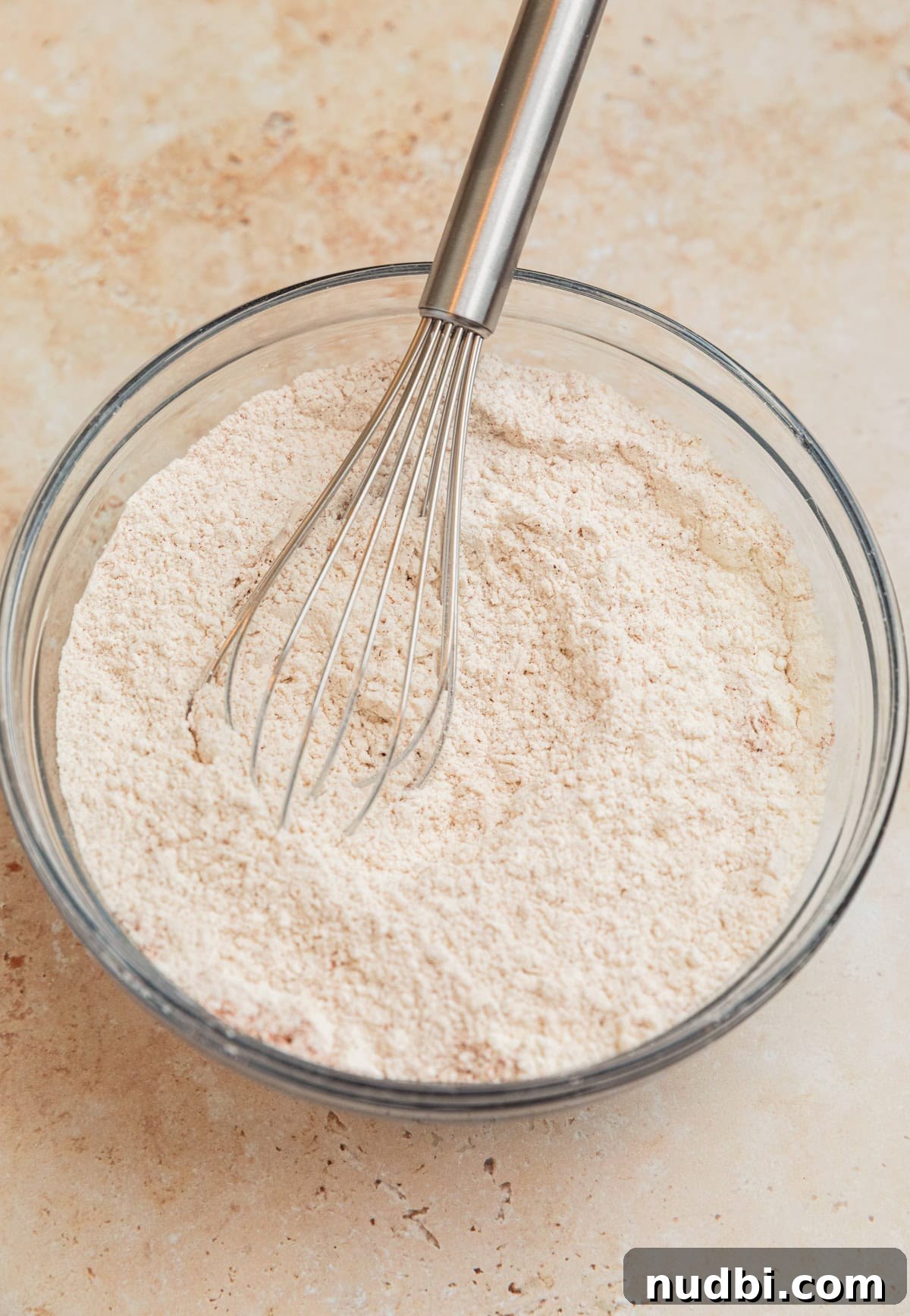 Moist Cinnamon Banana Bread Recipe with Warm Spice Flavor 5 Whisked dry ingredients in glass bowl.
