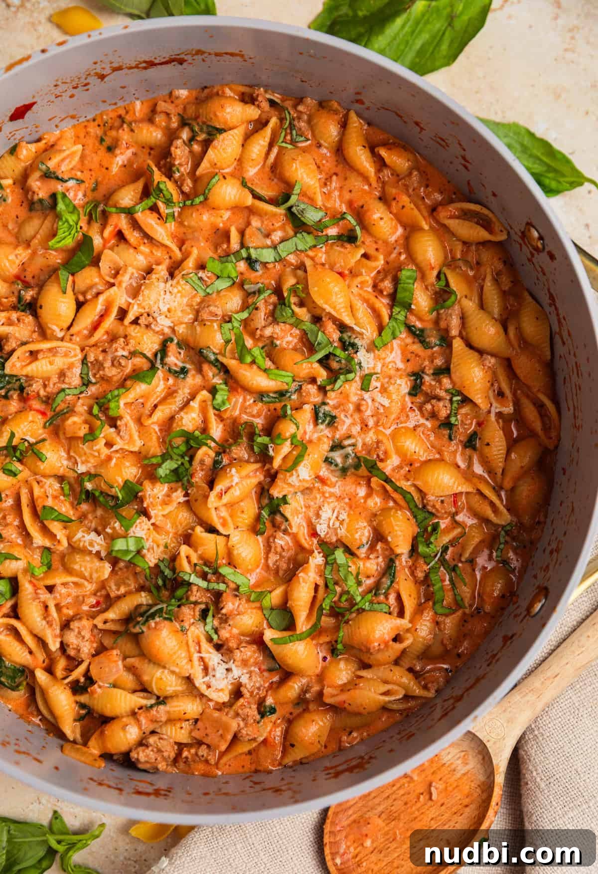 One-Pot Ground Turkey Pasta Dinner Recipe 11 Pot with creamy tomato turkey pasta topped with chopped basil.