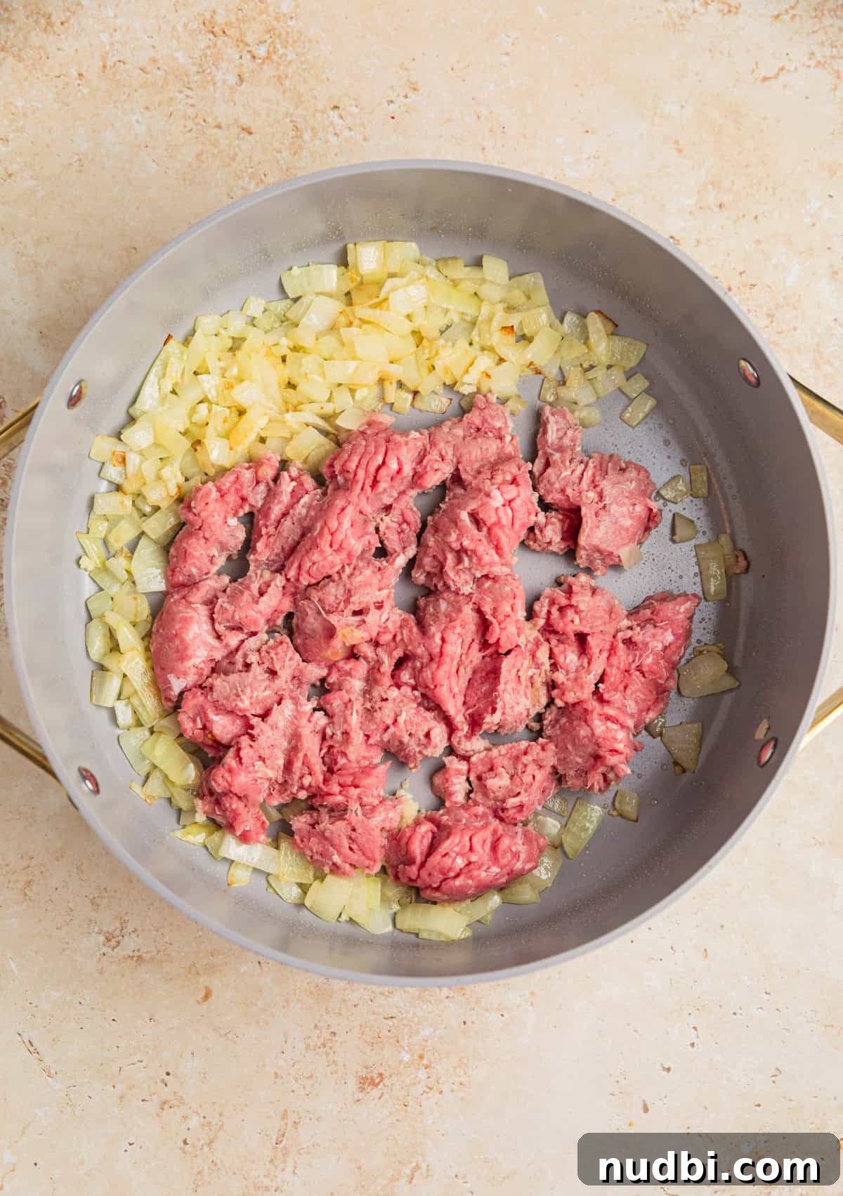 One-Pot Ground Turkey Pasta Dinner Recipe 5 Ground turkey and onions browning in skillet.