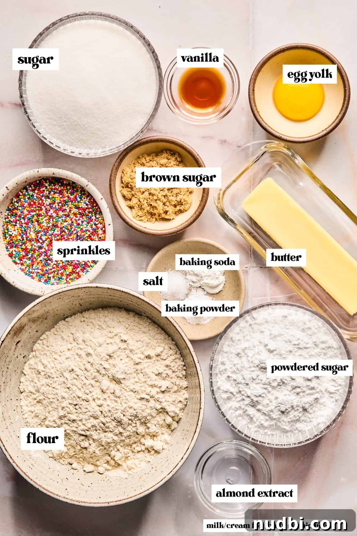 Iced Sugar Cookie Recipe: Soft, Chewy Cookies with Royal Icing 4 Flour, sugar, butter and other labeled ingredients on surface.
