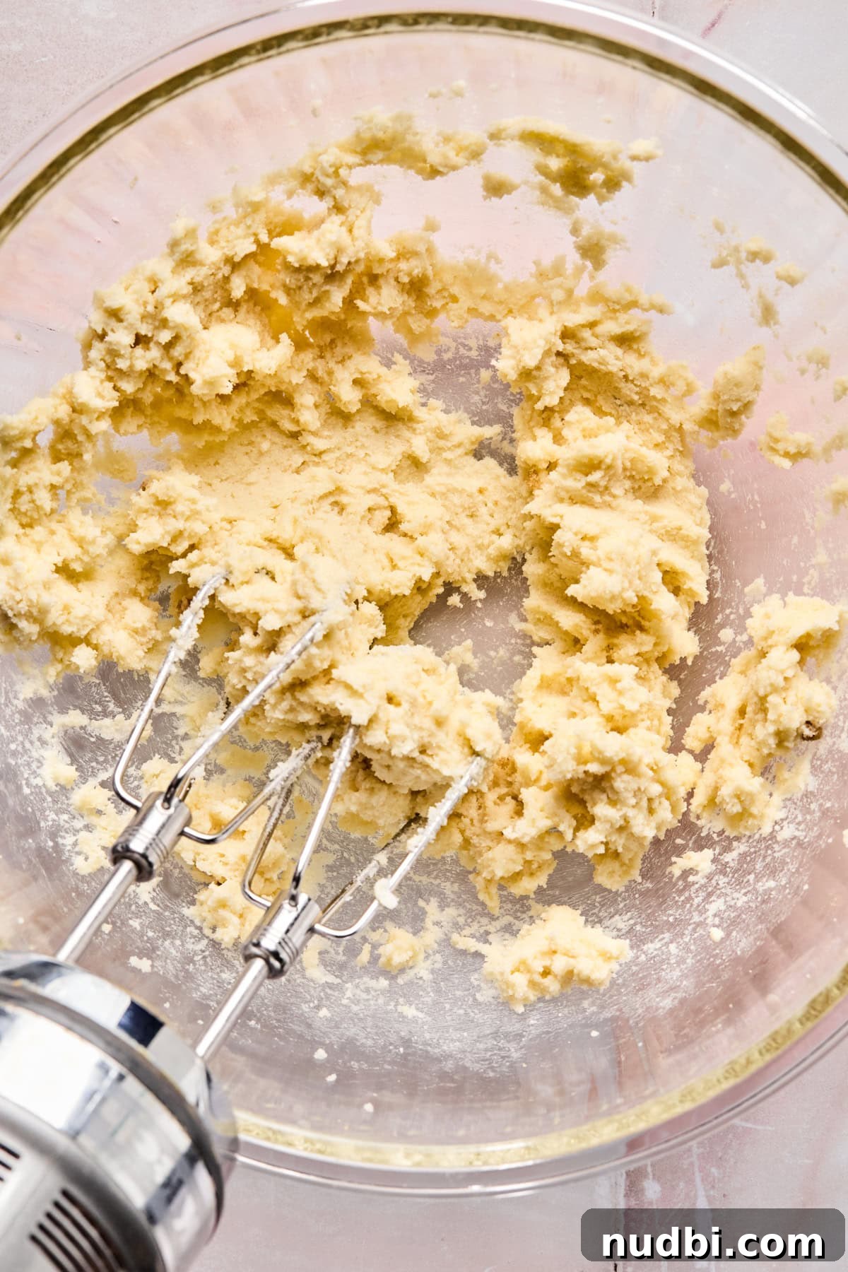 Iced Sugar Cookie Recipe: Soft, Chewy Cookies with Royal Icing 6 Butter and sugars creamed in glass mixing bowl.