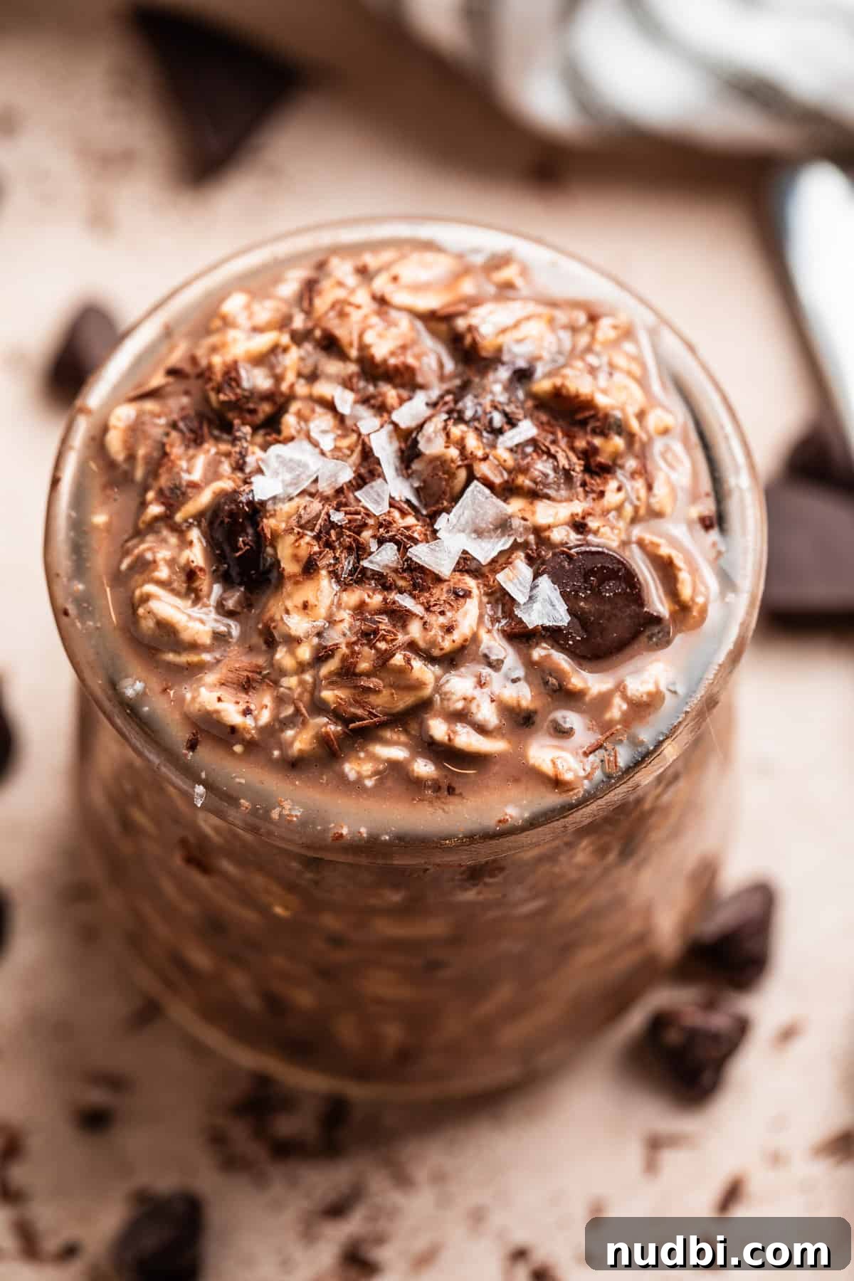 Triple Chocolate Overnight Oats Recipe for Chocolate Lovers 5 Chocolate oats in jar with salt and chocolate shavings to garnish.