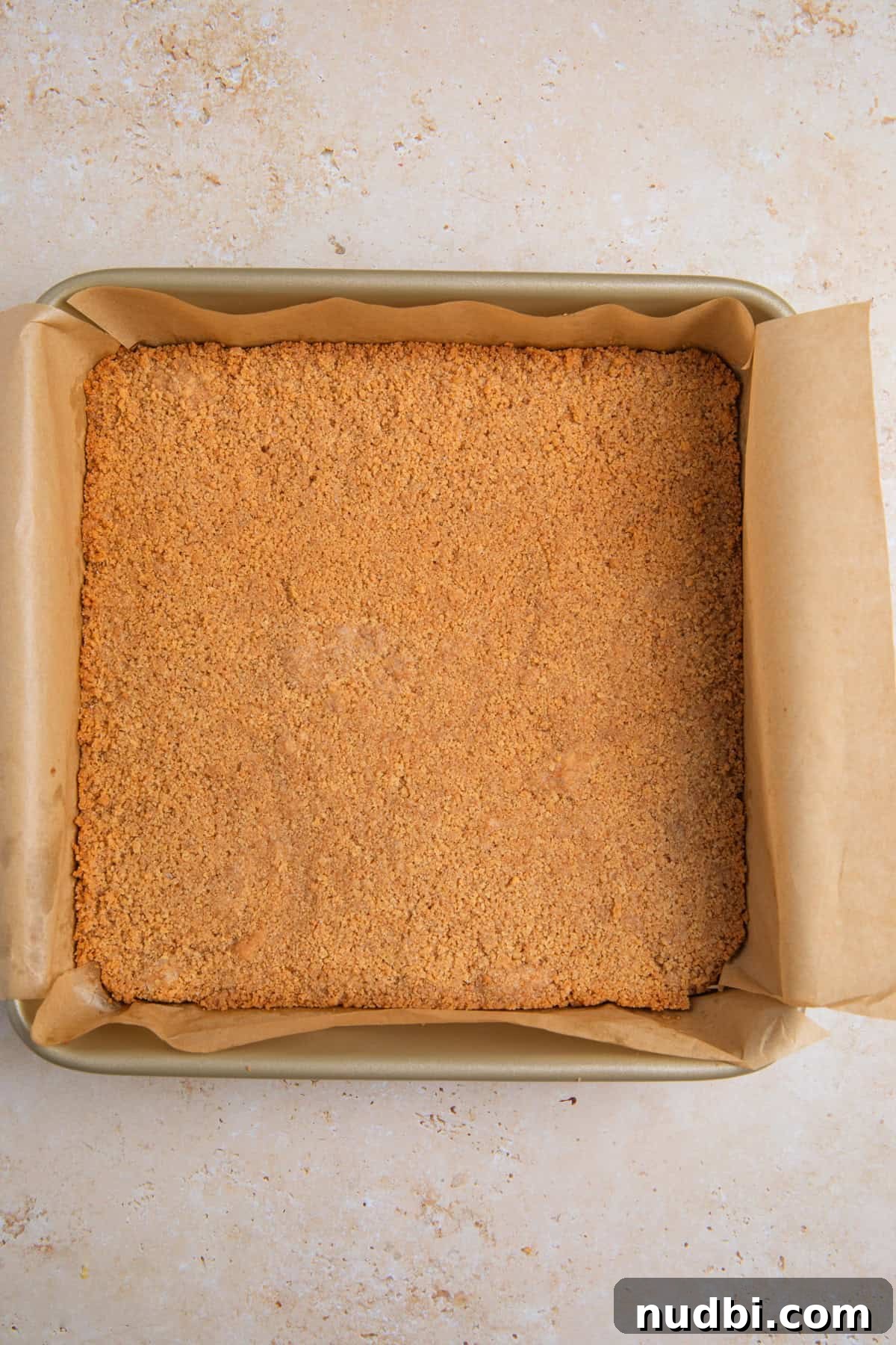 Creamy Lemon Bars with Graham Cracker Crust Recipe 8 Baked graham cracker crust in pan.