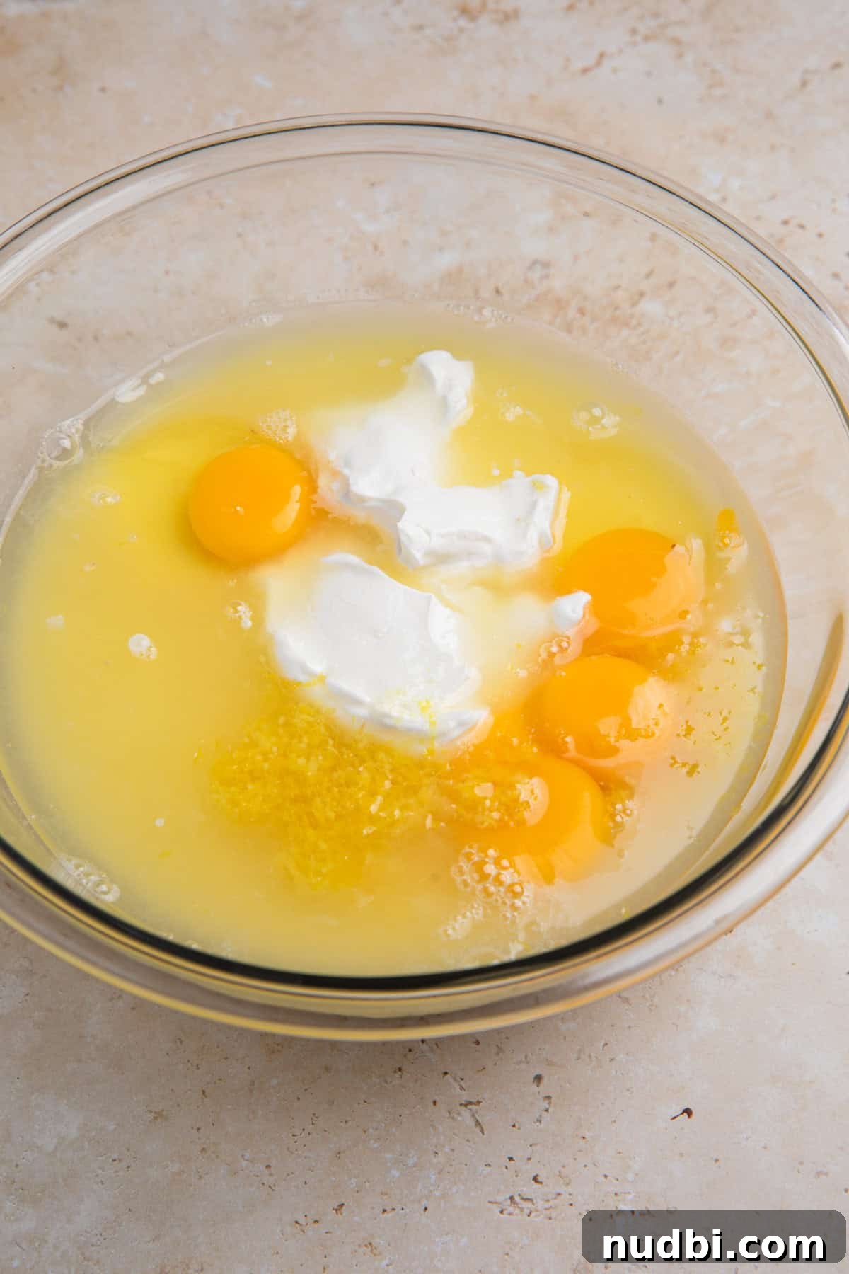 Creamy Lemon Bars with Graham Cracker Crust Recipe 9 Eggs and egg yolks, sour cream, lemon juice, condensed milk and other ingredients in large bowl.