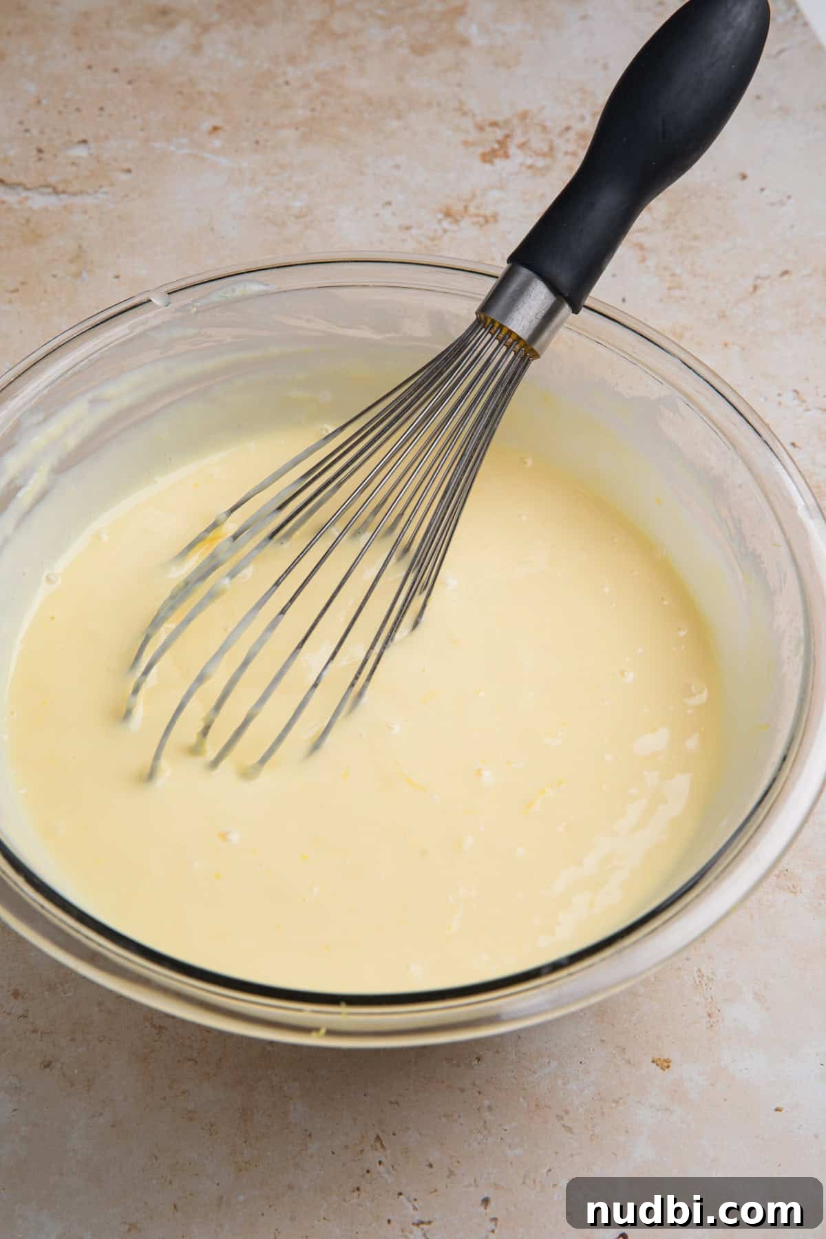 Creamy Lemon Bars with Graham Cracker Crust Recipe 10 Lemon bar mixture in bowl with whisk.