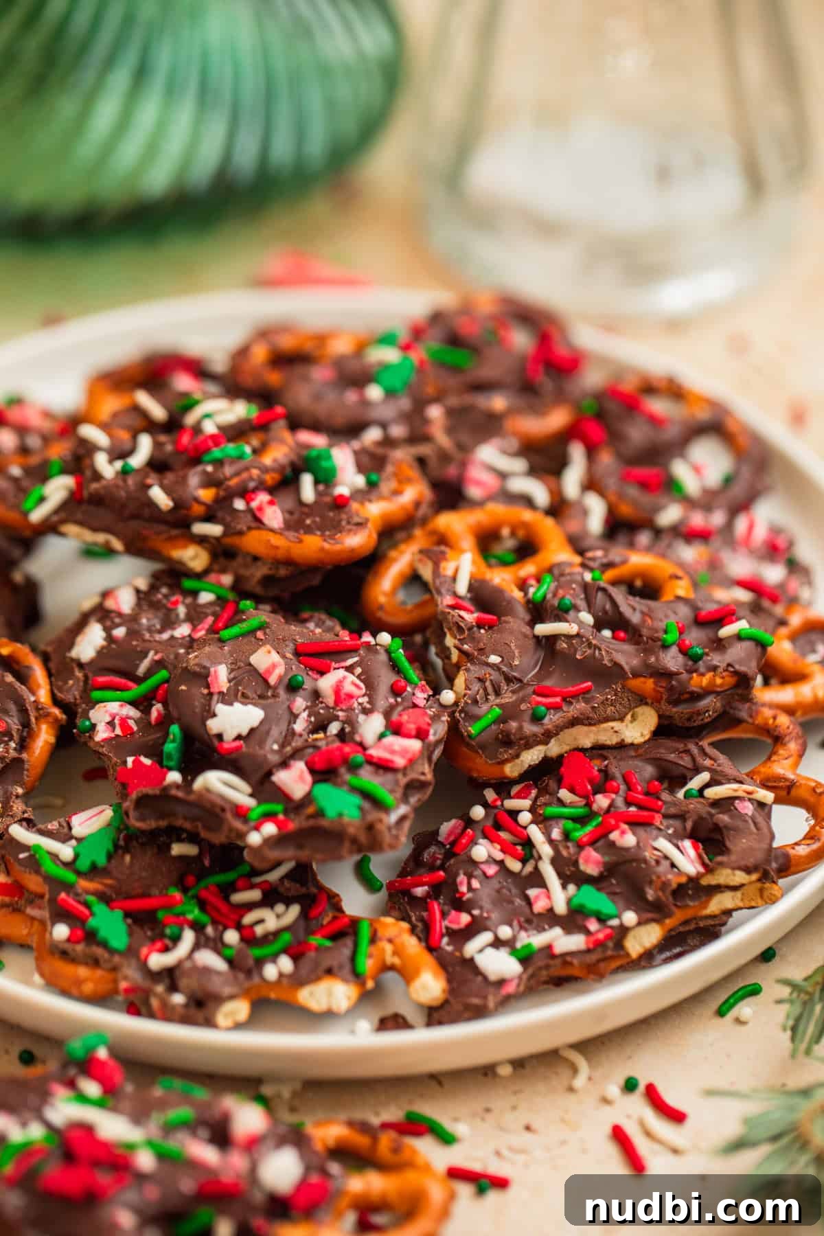 Peppermint Dark Chocolate Pretzel Bark Recipe for Holiday Treats 6 Dish with pieces of dark chocolate bark with pretzel twists in it.