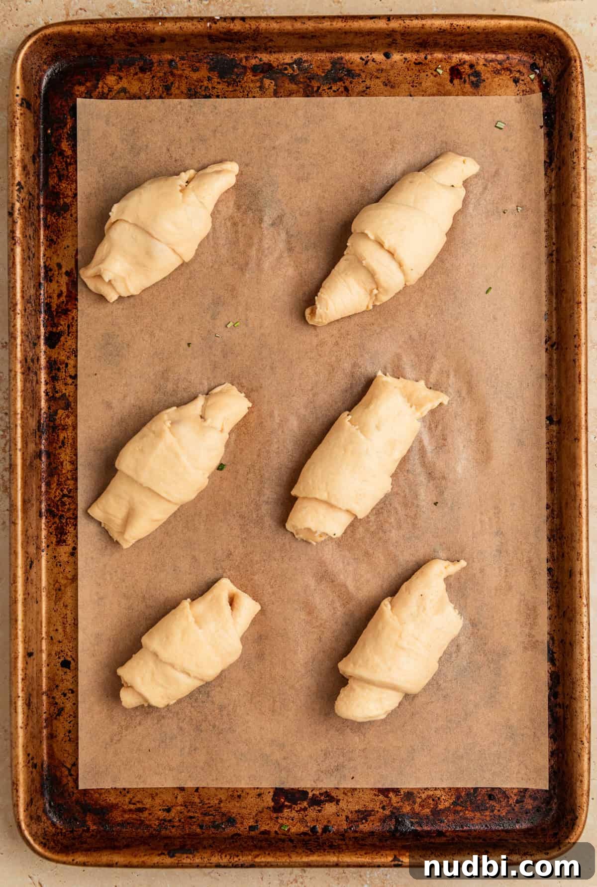 Baked Brie Crescent Rolls with Honey & Cranberry Jam 6 Crescent rolls before baking on sheetpan.