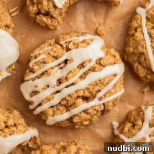 Cinnamon Roll Breakfast Cookies: Soft, Swirled Morning Treats 14 Cinnamon breakfast cookies on parchment.
