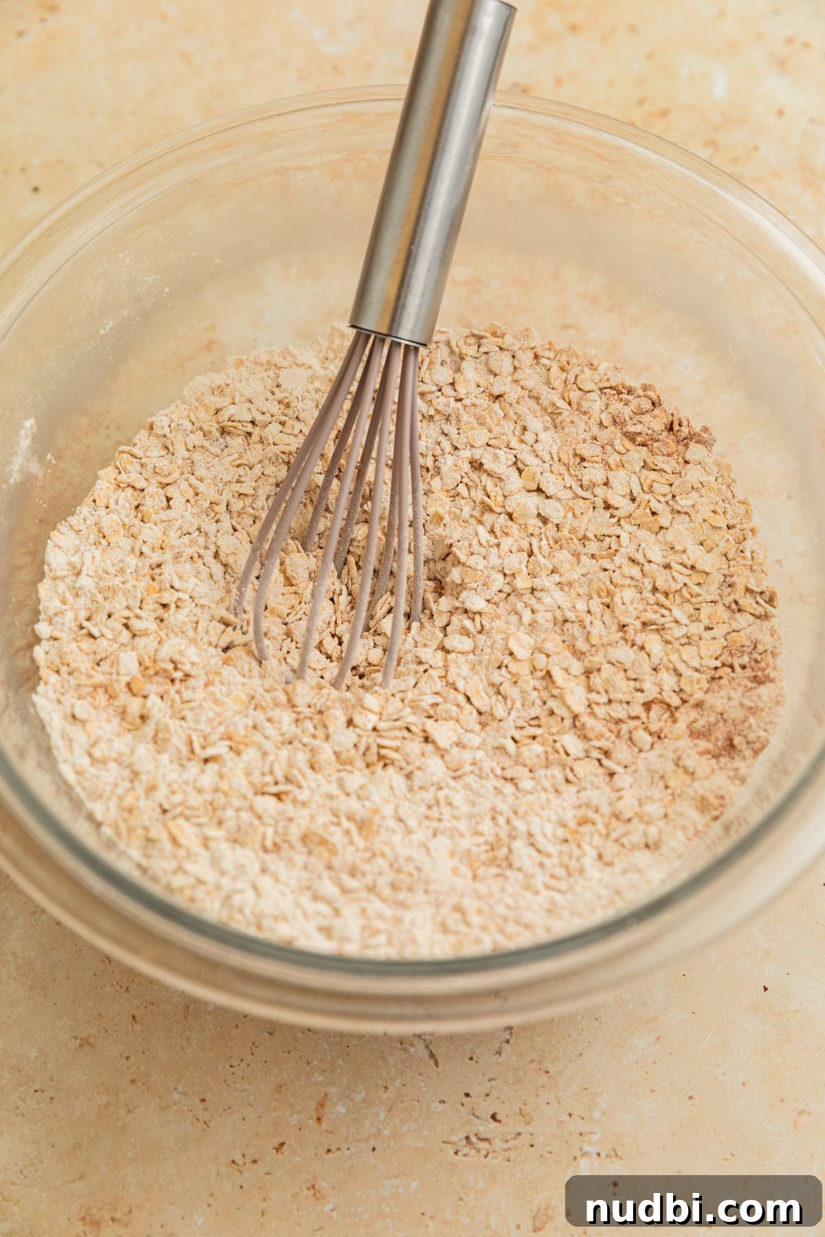 Cinnamon Roll Breakfast Cookies: Soft, Swirled Morning Treats 7 Mixed oats and flour with whisk in bowl.