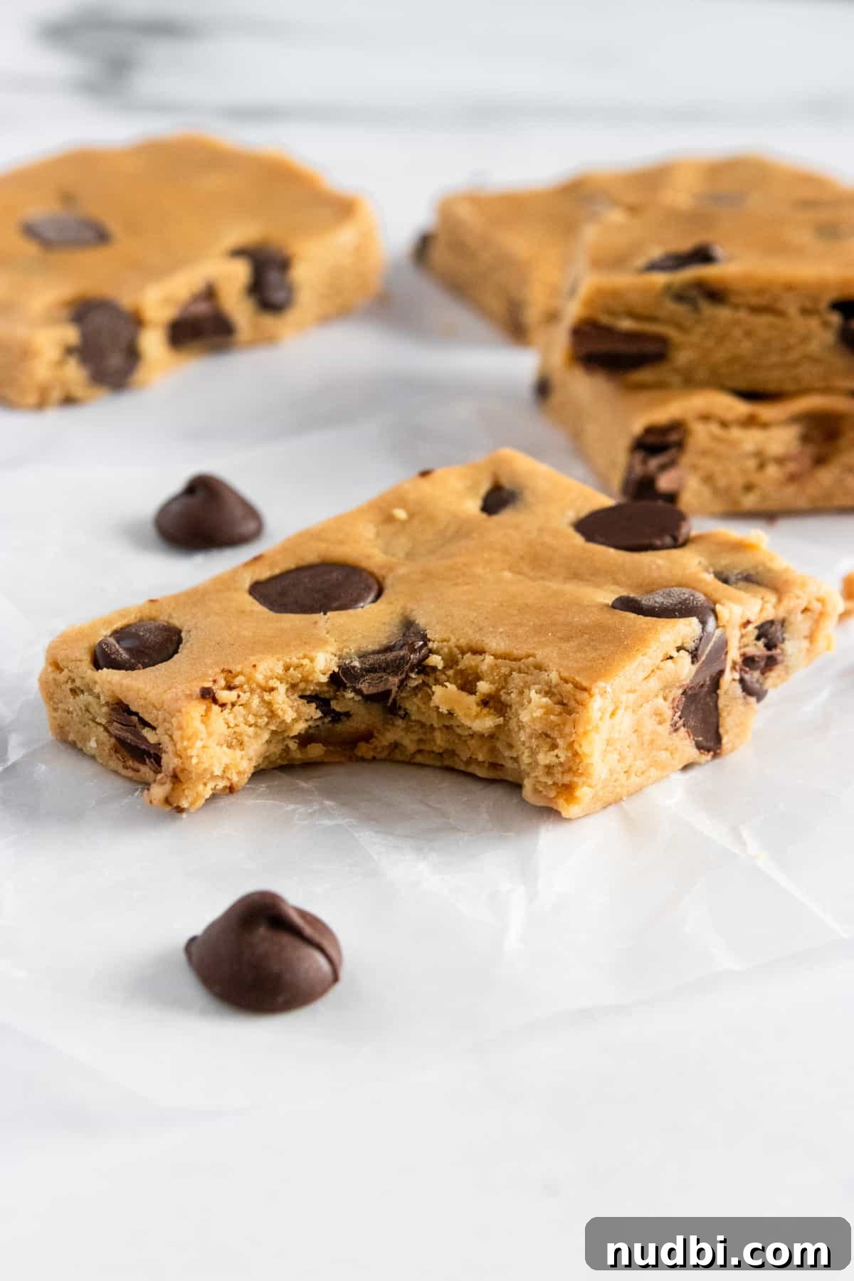 Perfect Homemade Protein Bars Recipe for Meal Prep 2 Bite taken out of peanut butter protein bar.