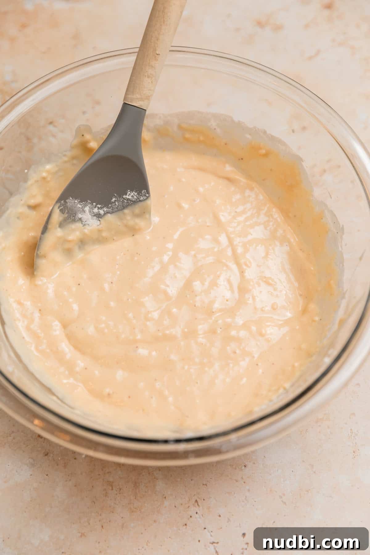 Light and Fluffy Greek Yogurt Donuts Recipe 7 Greek yogurt donut batter in bowl with spatula.