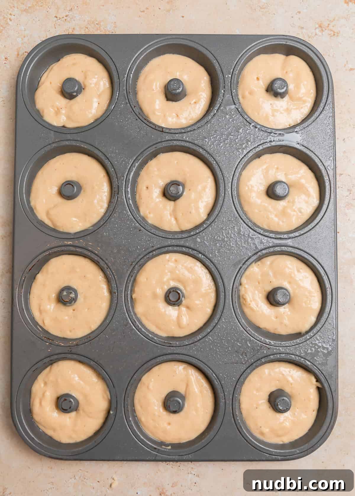 Light and Fluffy Greek Yogurt Donuts Recipe 8 Donut pan with batter before baking.
