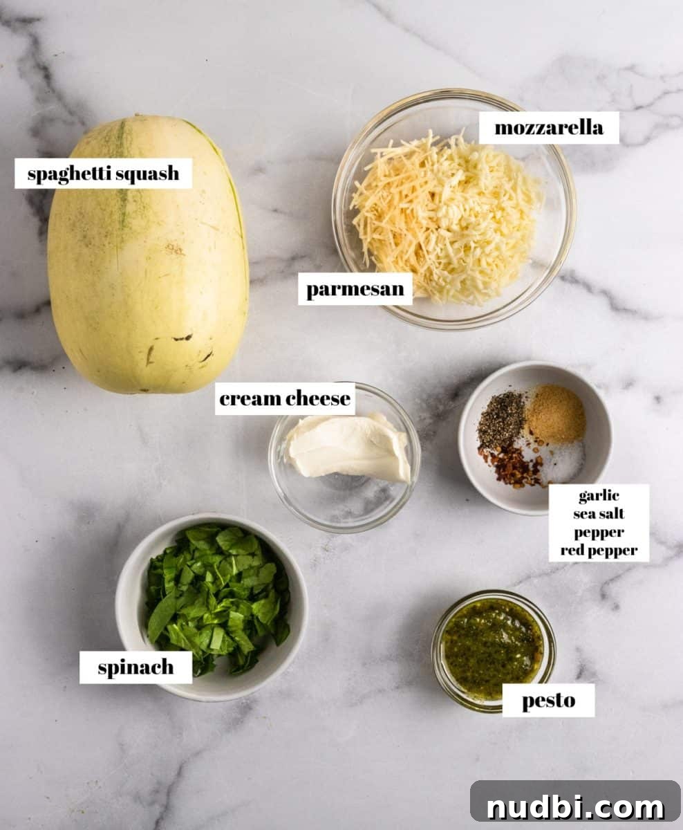 Ingredients to make stuffed spaghetti squash labeled on counter.