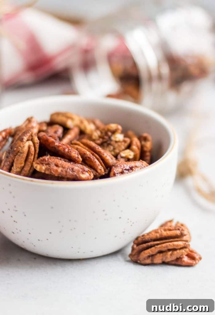 Maple Vanilla Spiced Pecans Recipe — Sweet & Crunchy Snack 3 Simple roasted and maple sweetened pecans with a dusting of cinnamon and hints of vanilla are the perfect snack, holiday treat, salad topper and more! This easy spiced pecan recipe makes perfect holiday gifts as well!